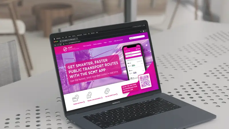 A website displaying a smartphone and QR Code on a laptop.