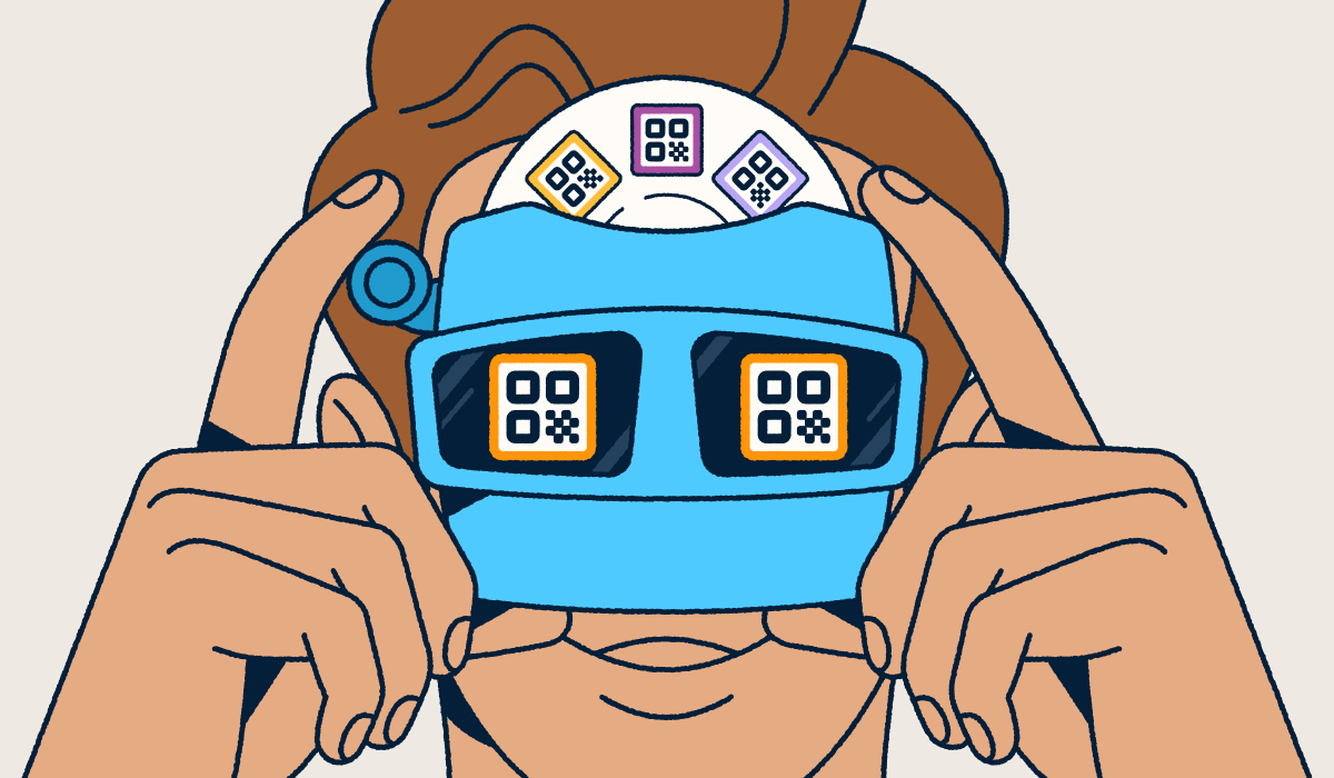 Person looking through goggles at different QR Code designs.