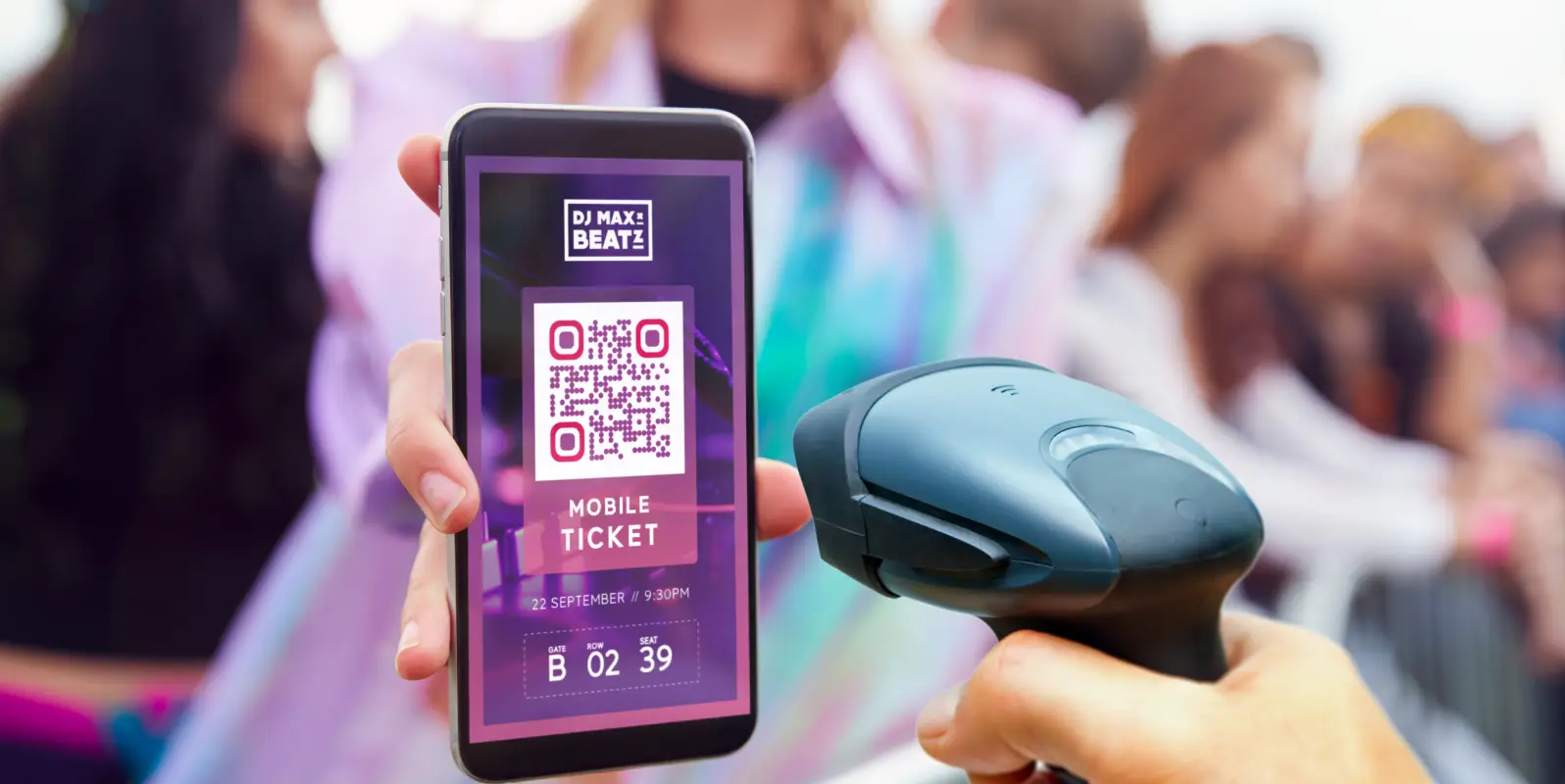 person holding their smartphone displaying a mobile QR Code ticket and a hand scanning it with a barcode scanner.